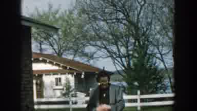 Wisconsin (1957): A Middle Aged Woman Wearing A Necklace And A Light Green Vest