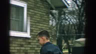 Wisconsin (1957): Child Sitting Next To A Lady On The Sidewalk Of The House To