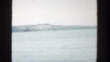 Wisconsin (1957): A Breathtaking View Of Water And Mountains In The Background