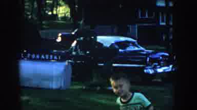 Wisconsin (1957): Child In A Garden Playing With A Mailbox With A Car And A House