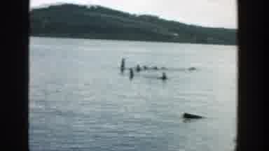 Wisconsin (1957): Wide View Of A Landscape With A Child In The Lake And Mountains