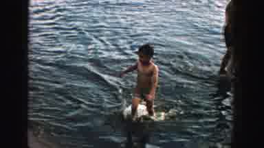 Wisconsin (1957): Boy Coming Out Of The Water With A Face Of Being Cold