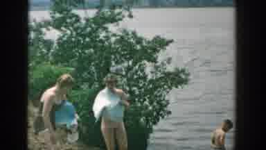 WISCONSIN-1957: Family Of Four At Lakeside With Blue Towel