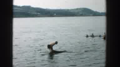 Wisconsin (1957): People Swimming Waving And Playing In The Water Man Jumping Off