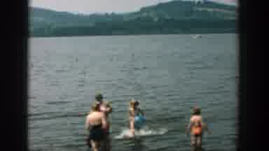 Wisconsin (1957): Five People Splashing In Lake Water On A Clear Sunny Day