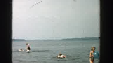 Wisconsin (1957): Some Women And Children Enjoy A Relaxing Day By The Water