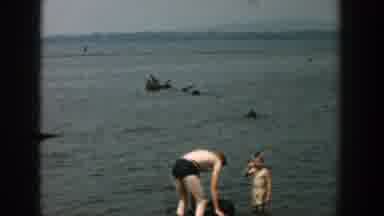 Wisconsin (1957): Women In A Garden And People Enjoying The Sunny Day By The Sea