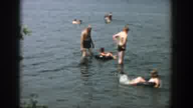 Wisconsin (1957): People Playing Outside In And Near Lake