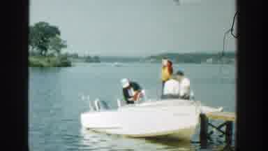 Wisconsin (1957): People Inside A Boat By The Lake And Landscape With Trees In The