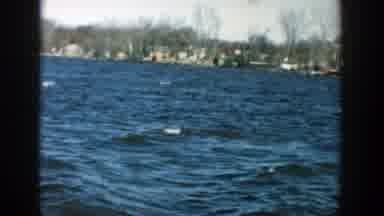 Wisconsin (1957): View Of Blue Water Waves And Grey Hill On A Clear Sunny Day