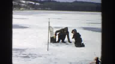Wisconsin (1957): Man And A Child Is Playing On The Ice And Woman Standing