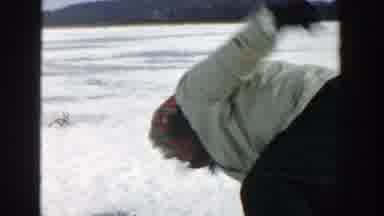 Wisconsin (1957): Woman Rising From Snow-Covered Terrain And Man Picking Up