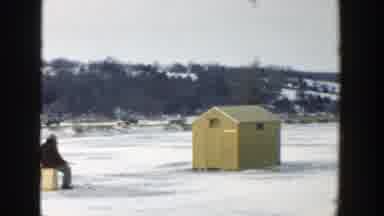 Wisconsin (1957): A Group Of People Sit And Walk On A Frozen Lake In The Winter