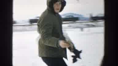 Wisconsin (1957): Boy Wearing Black Jacket Pets German Shepard Puppy On A Clear