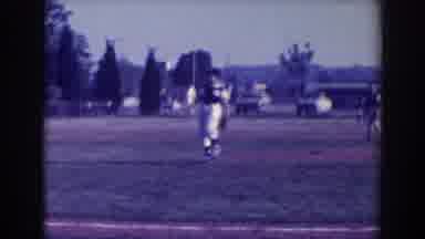 North Hollywood California (1961): Several Kids In Uniforms Playing Baseball In A