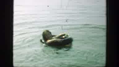 Connecticut (1947): Child Resting Her Head On A Floater