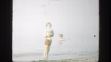 Connecticut (1947): Two Children Playing With A Ball On The Beach Dressed In A Red