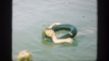 Connecticut (1947): Little Girl Rests Her Head On A Floater Then Decides To Play