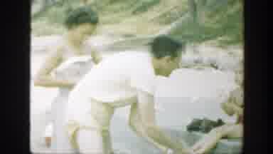 Connecticut (1947): Man Wearing White Shirt Dries Foot Of Small Girl Wearing Red