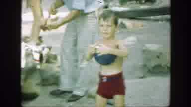 Connecticut (1947): Boy In Red Pants Holds Basketball Enjoys On The Beach With His