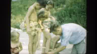 Connecticut (1947): Dad Tidying Up His Kids So They Can Play On The Beach