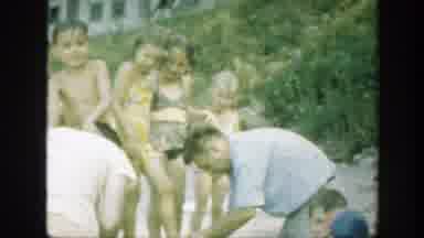 Connecticut (1947): Family Gathered On The Beach Child With Flowers Swimsuit And