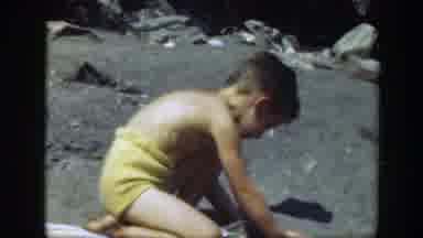 Connecticut (1947): Kid Playing On A Beach On A Hot And Sunny Day