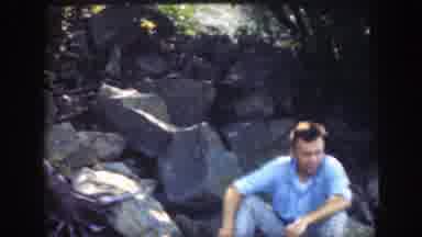 Connecticut (1947): Man Wearing Blue Shirt Sits On Grey Rock On A Clear Day