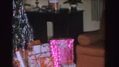 Nebraska (1955): Wrapped Presents Sit Near Decorated Christmas Tree In Living Room