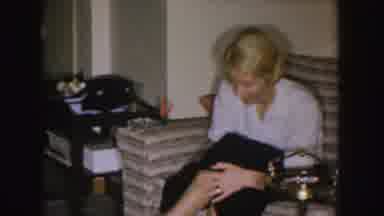 Nebraska (1955): Woman Wearing Black Skirt Laughing And Talking With Man Wearing