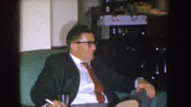 Nebraska (1955): Man Sitting In A Room With His Wife Takes A Drink And Removes His