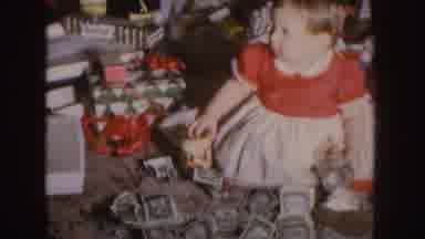 Nebraska (1955): Child Opening Presents Surrounded By Cash