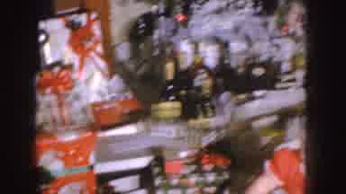 Nebraska (1955): Child In Red Sitting On The Living Room Floor Opening His