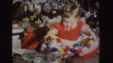 Nebraska (1955): Baby Playing With His Toy On A Table Full Of Alcohol