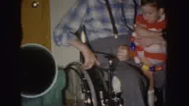 Nebraska (1955): Old Recording Of A Little Girl Being Held By A Man On Wheelchair