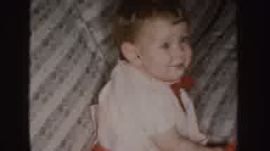 Nebraska (1955): Small Child Sitting Then Starting To Crawl On A Couch