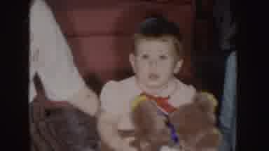 Nebraska (1955): Boy With Teddy Bear And Girl Watching With Their Mother At Home