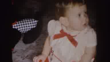 Nebraska (1955): A Girl Sitting On The Floor Dressed In White And Red Socks