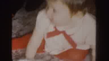 Nebraska (1955): A Young Child Possibly Playing Peek-A-Boo With An Adult