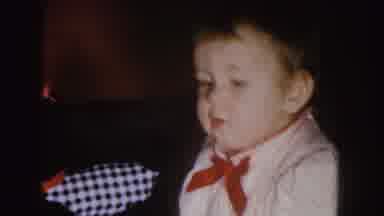 Nebraska (1955): Toddler Wearing Red And White Shirt Looks Around Room Then At