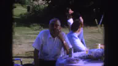 Nebraska (1955): Three Men Wearing White Shirts Sit At Table Talking On A Clear