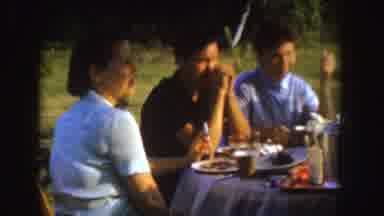Nebraska (1955): Some People Socializing Outdoors And Eating