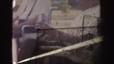 Nebraska (1955): Old People Sitting On Chairs In Front Of The House And Children