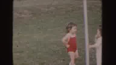 Nebraska (1955): Children Standing On The Lawn Beside An Iron Rod Reaching Out And
