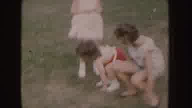 Nebraska (1955): children Of Various Ages Playing In A Clear Field With
