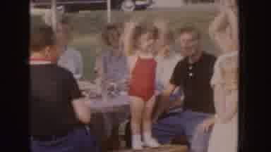 Nebraska (1955): Little Girl Having Fun All Her Relatives While Dancing On A