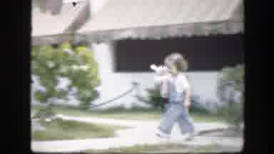 Florida (1945): Little Girl In A Blue Jumper Running Around With A Stuffed Toy In