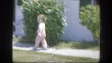 Florida (1945): Woman Wearing Red Shorts Walks Into A White House On A Sunny Day