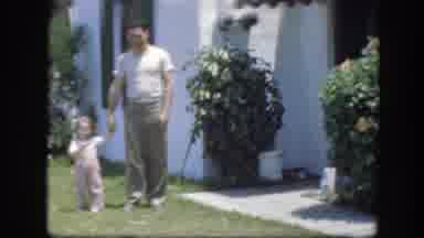 Florida (1945): A Father Holding His Young Daughters Hands While Walking In