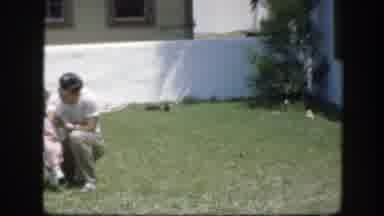 Florida (1945): A Man In A White Shirt Playing And Laughing With A Girl Dressed In